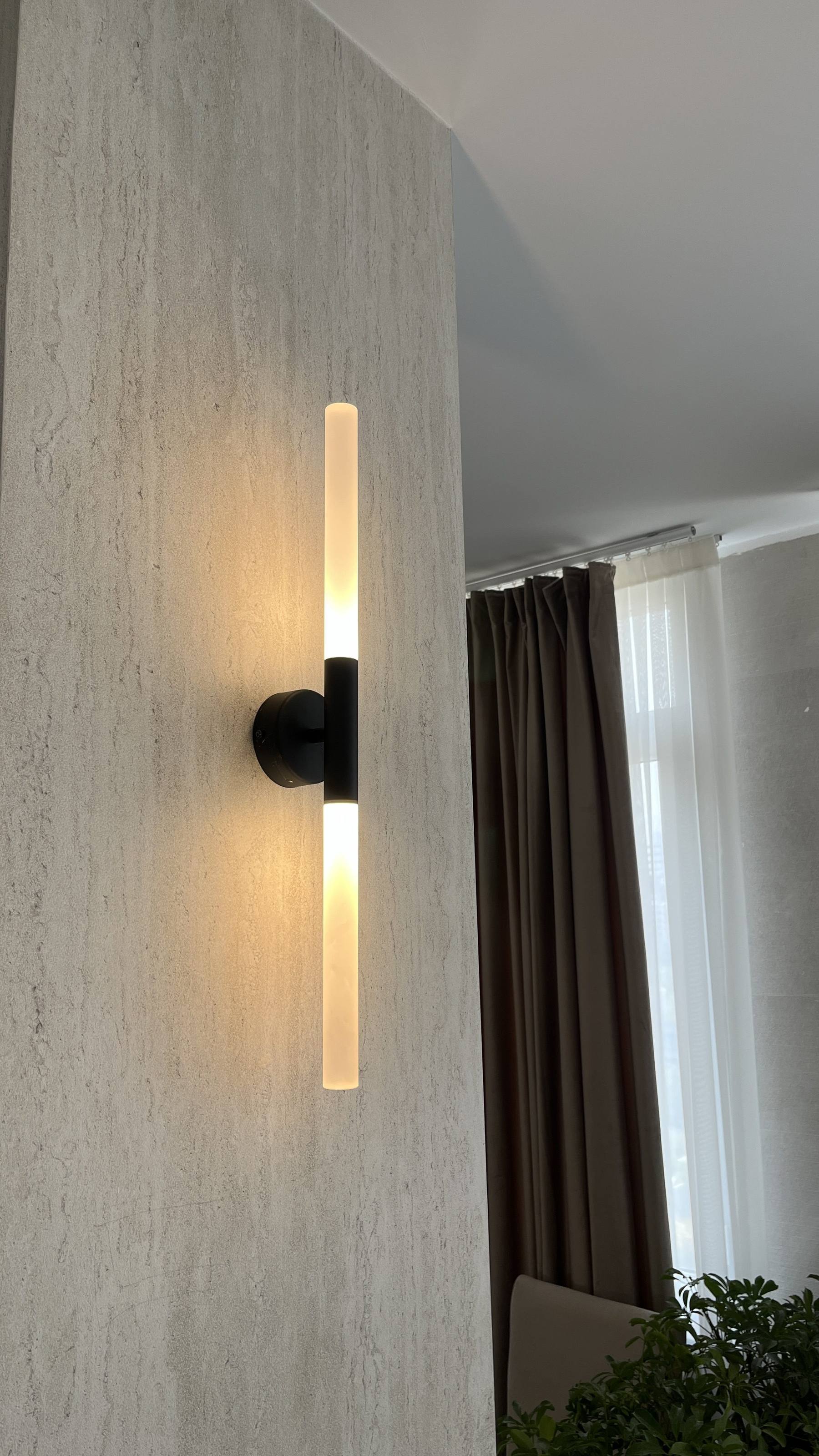 Wall sconce — cylindrical black fitting